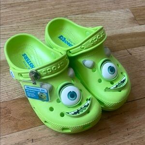 CROCS Green Sandals with Playful Design worn once in the house still brand new